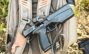 maxim 9mm handgun with integrated suppressor
